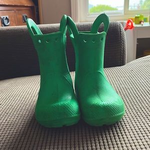 Green Crocs with the easy pull on handle
